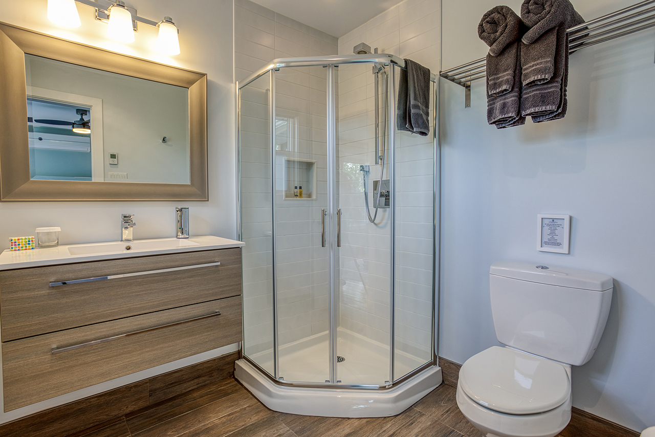 Mountain Suite private ensuite bath with shower, sink and toilet.